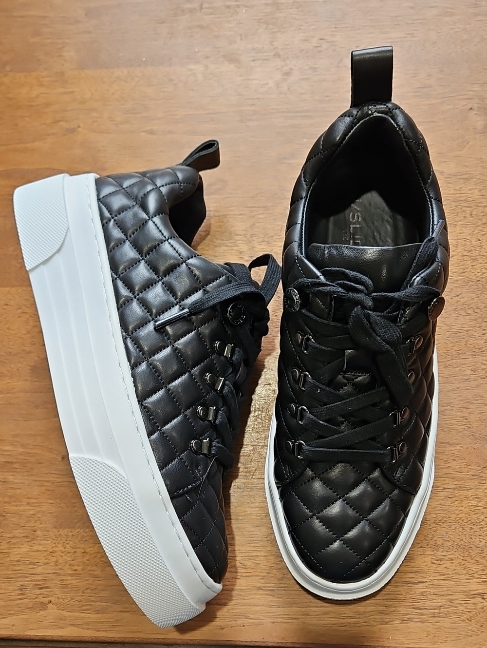 the J/Slides Aimee Quilted Platform Sneakers, featuring a soft diamond-quilt